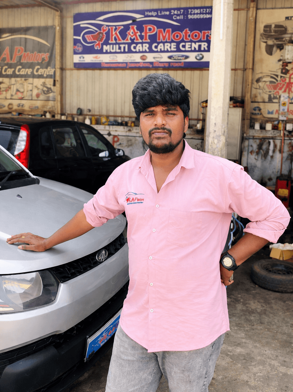 Mechanic working on car engine